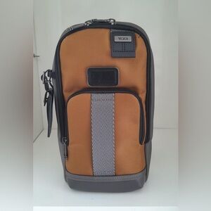 NWT Tumi FIFE Slim Sling Bag Golden Brown and Gray